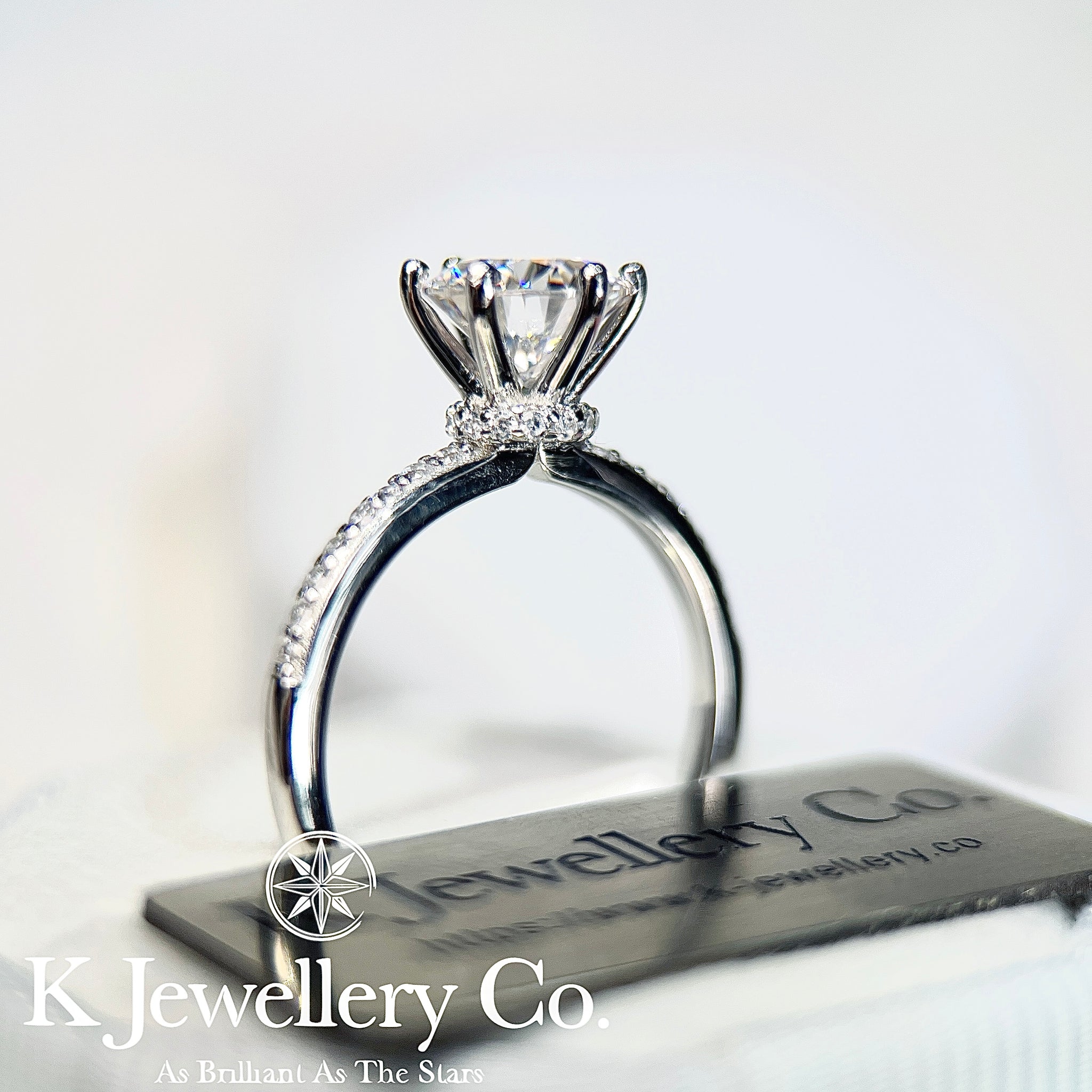 Round Brilliant Cut Solitaire Diamond Engagement Ring, 6 Square Claws Set  on Bead Set Band with Raised Crown Setting.